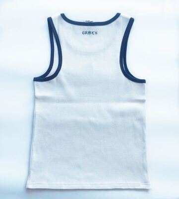 Mens tanktop featuring 100 percent cotton waffle fabric body solid color with contrast color rib piping around neck and armhole