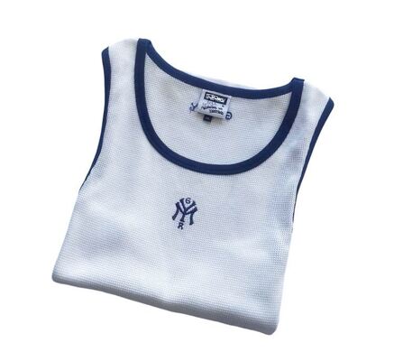 Mens tanktop featuring 100 percent cotton waffle fabric body solid color with contrast color rib piping around neck and armhole